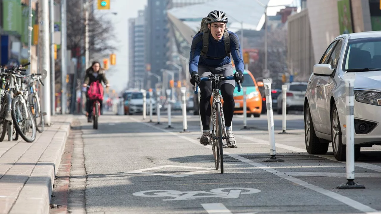 Is it safer to bike on the roads in the suburbs or in the city?